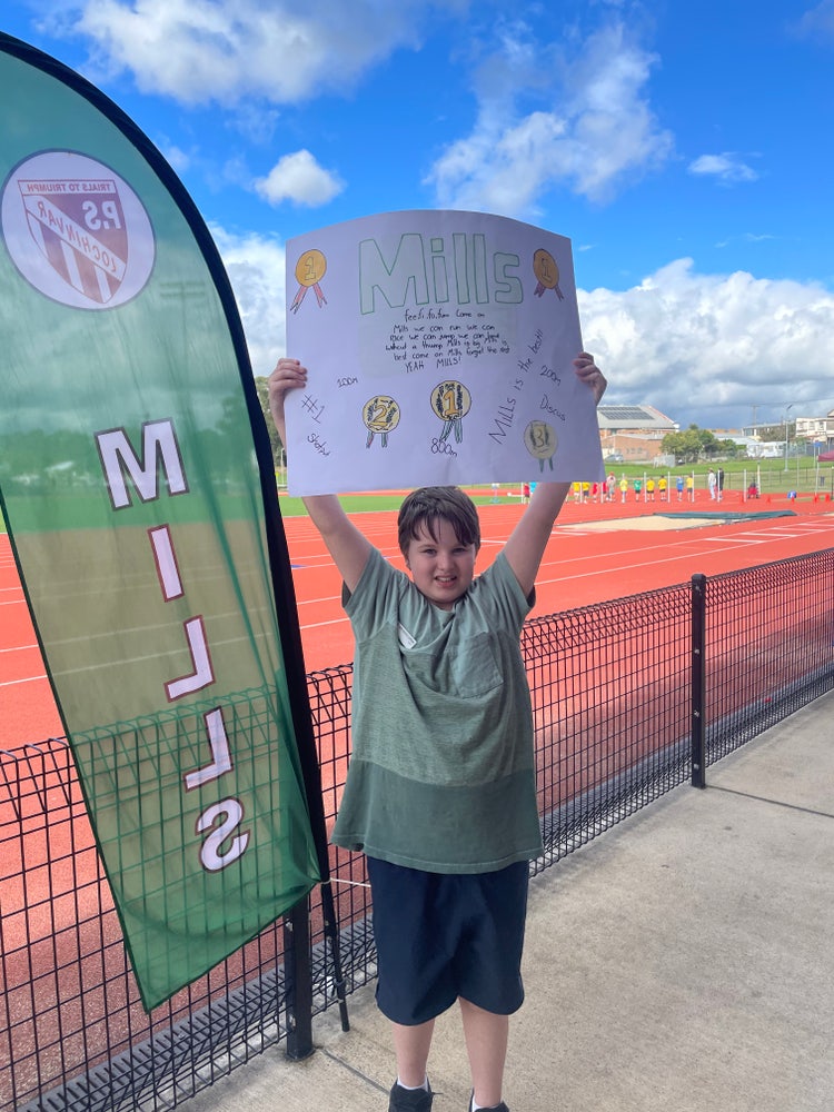 Student cheering on students at Primary Athletics Carnival – Years 3 to 6