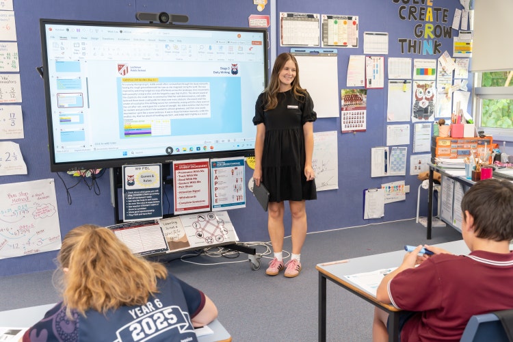 Teacher guiding class in classroom