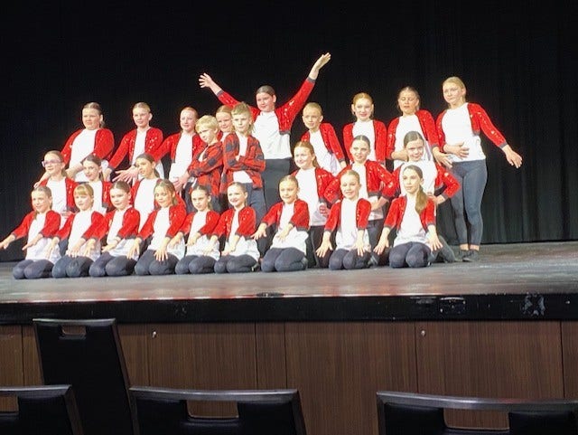 Picture of studnets on stage in costume performing at Hunter Dance Festival